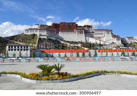 Tibet, Lhasa, China, October, 04, 2013. People walking near the Potala Palace - the former residence of the Dalai Lamas