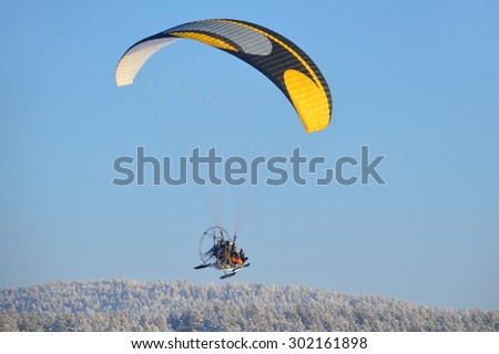 Kaga, Bashkortostan, Russia, January, 03, 2013. Flight on a motorized paragliders in the winter, the South Ural