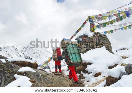 Nepal, Himalayes,  October, 19, 2013. Porters in the Himalayas with cargo, 4500 meters above sea level