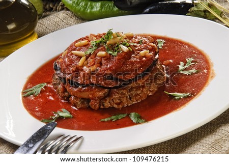 Dish of Arabic meat in tomato sauce.