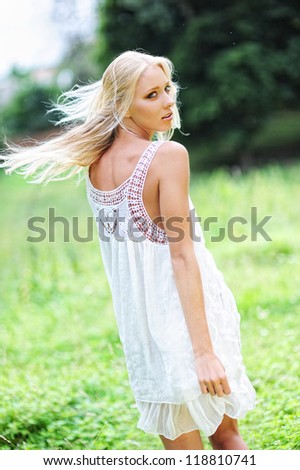 Romantic summer portrait of yang and pretty light haired girl.