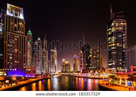 DUBAI, UAE - MARCH 21: Dubai Marina at dusk  March 21, 2014, Dubai, UAE. In the city of artificial channel length of 3 kilometers along the Persian Gulf.