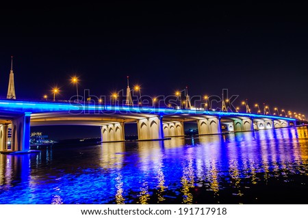 DUBAI, UAE - APRIL 24 of 2014 : Business bay crossing bridge,13-lane-brid ge, over the Dubai Creek,opened in March 2007.
