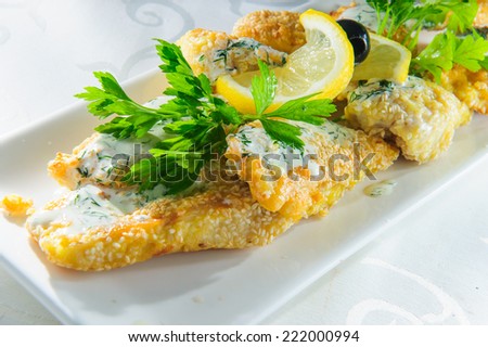 Plate of roasted fish.