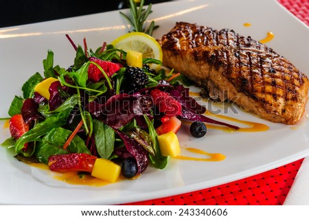 Roasted salmon with berry side dish.