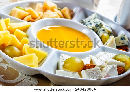 Picture of multiple cheese plate with yellow sauce