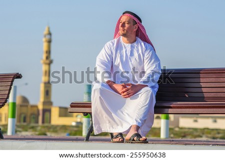 Portrait of Middle Eastern Arabic man in front of mosque.