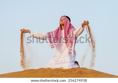 Portrait of Middle Eastern arab man in the desert.