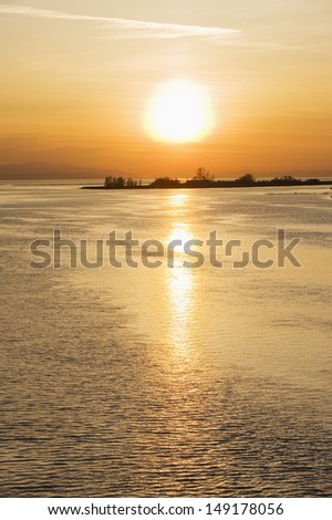 sunset over the Strait of Georgia at Middle Arm in Richmond Vancouver British Columbia Canada