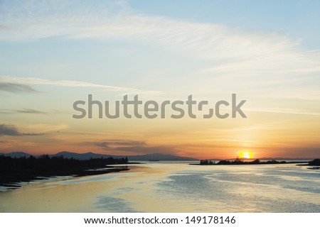 sunset over the Strait of Georgia at Middle Arm in Richmond Vancouver British Columbia Canada