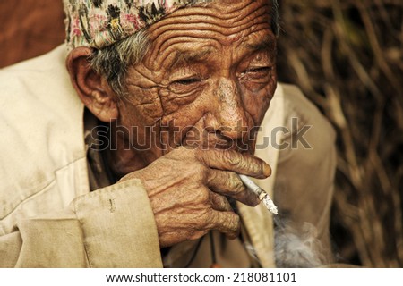 Gurkha, Nepal. September, 01, 2010. Elderly man smoking in Gurkha, Nepal