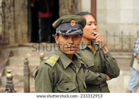 Patan, Nepal. August, 22, 2010. Nepalese female cop in Patan