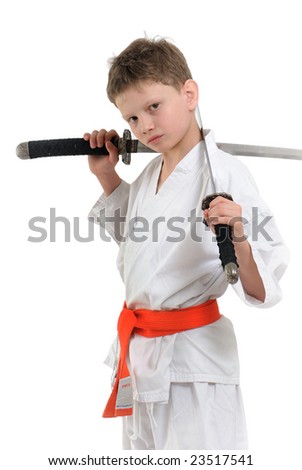 boy with two japanese blades peers into camera