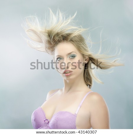 female face with long beauty hair, wind blows on hairs