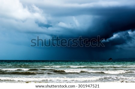 Rain storm over the ocean by the coast of Krabi in Thailand