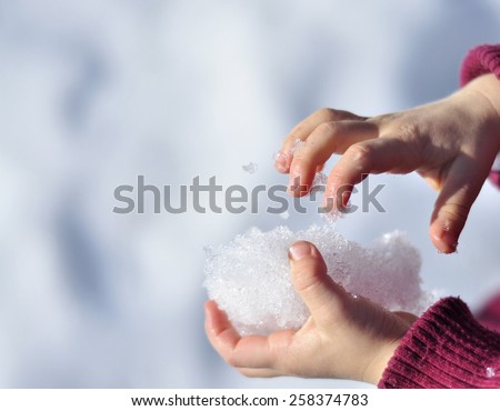 snow melts in the hands of a child