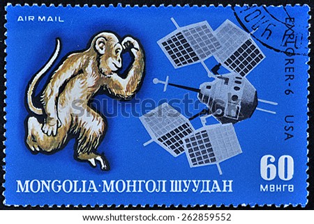 Mongolia - circa 1972: A post stamp printed in the Mongolian shows evolution from monkey to space satellite Explorer-6 USA , circa 1972.