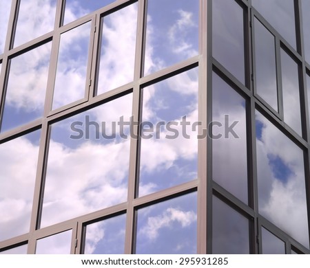 Clouds reflected in the tinted Windows of the building.