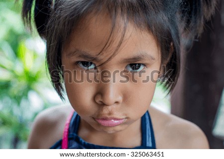 a sad little Asian girl  people, emotion concept