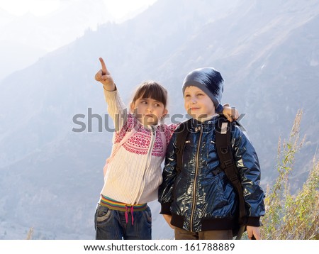 Funny hiking caucasian boy and girl