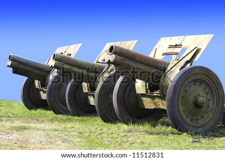 russian cannons from second world war on peaceful sky background