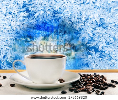 hot coffee near frozen winter window