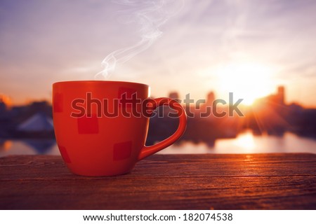 morning coffee with city view in sunrise
