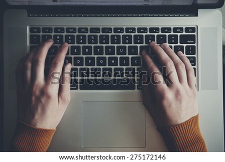 hands with laptop typing