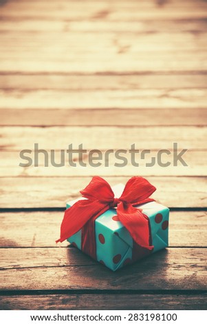gift box on wooden table as natural background with copyspace