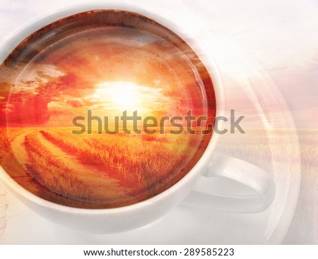 Double exposure. Cup of coffee with morning sunrise landscape inside