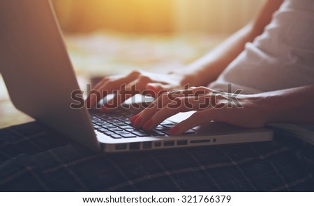 hands with laptop typing