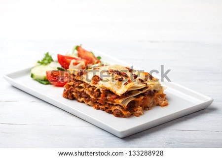 italian lasagna on a square plate