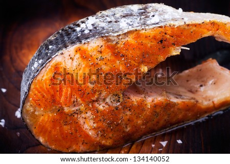 grilled salmon steak on wood