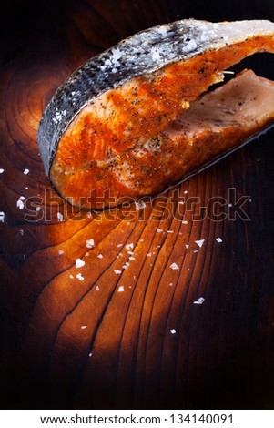 grilled salmon steak on wood