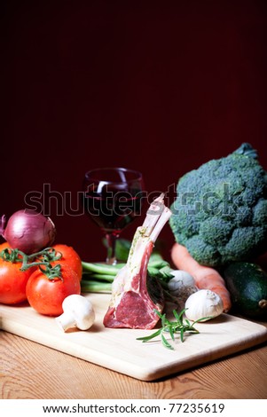 raw lamb meat and assorted vegetables