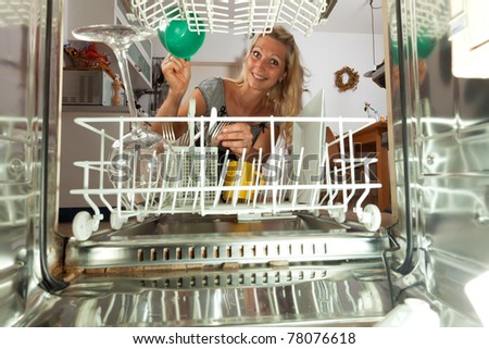 young woman seen from inside of a dish washer