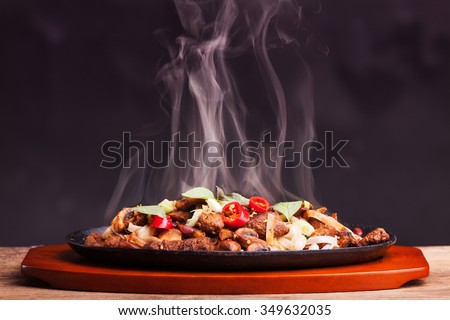 steaming chicken sizzler with noodles