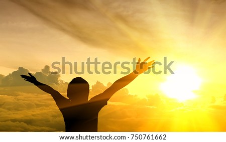 Men raise their arms up the sky. He thanks God