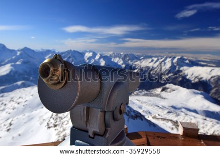 metal coin binoculars, binoculars on top of the mountains, panorama from a mountain peak, mountain peak in the french Alps, panorama from a high point