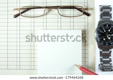 Money, paper, pencil and glasses with wrist watches