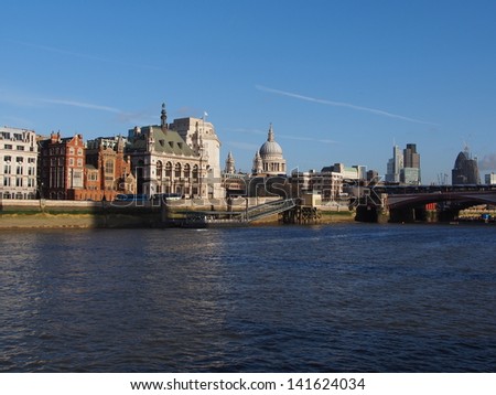 Thames river sightseeing on boat, you can see the dock, Blackfriars Bridge and St Paul\'s Cathedral