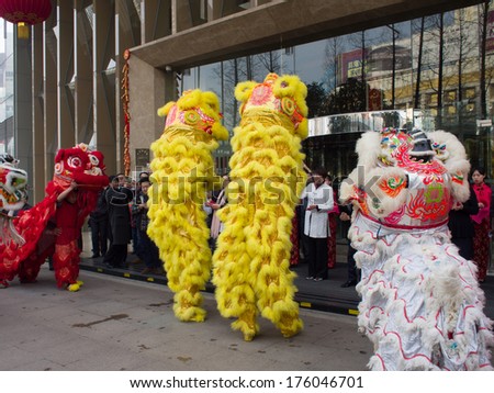 lion dance, take part in the celebration of Chinese New Year on Feb 1, 2014 in Wuhan, China. Various traditional performance attract many people to the street