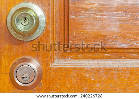 wood door texture with door knob and key lock