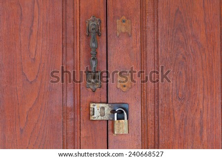 old dry wood door with metal handle and key locker