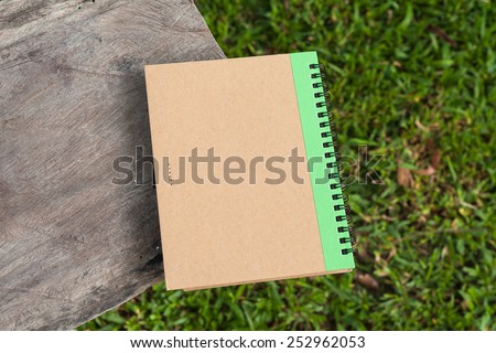 brown cover notebook on nature background