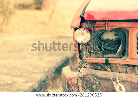 broken head light rusty truck, old color tone