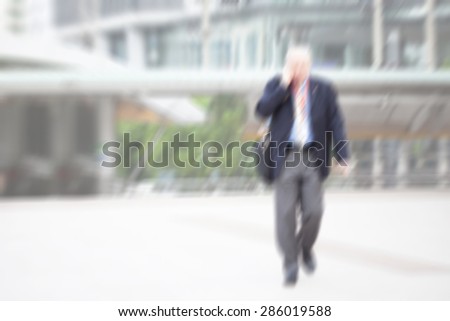 motion blur suit and tie businessman walking to work