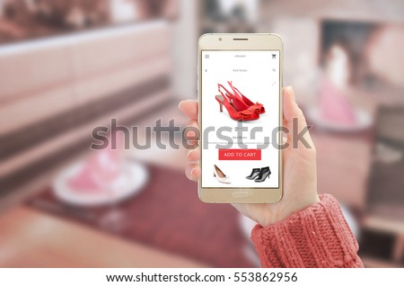 Woman showing modern gold smart phone with online shopping app on device display. Woman red shoes and add to cart button.