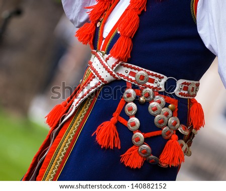 horizontal color image of traditional polish costume