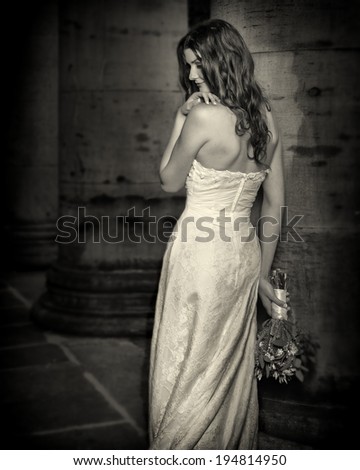 Beautiful Happy bride with wedding flowers bouquet in white dress with wedding hairstyle and makeup. Smiling woman in wedding dress waiting for groom. Pretty brunette girl bride.